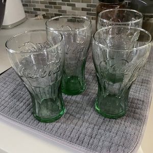 four coke glasses